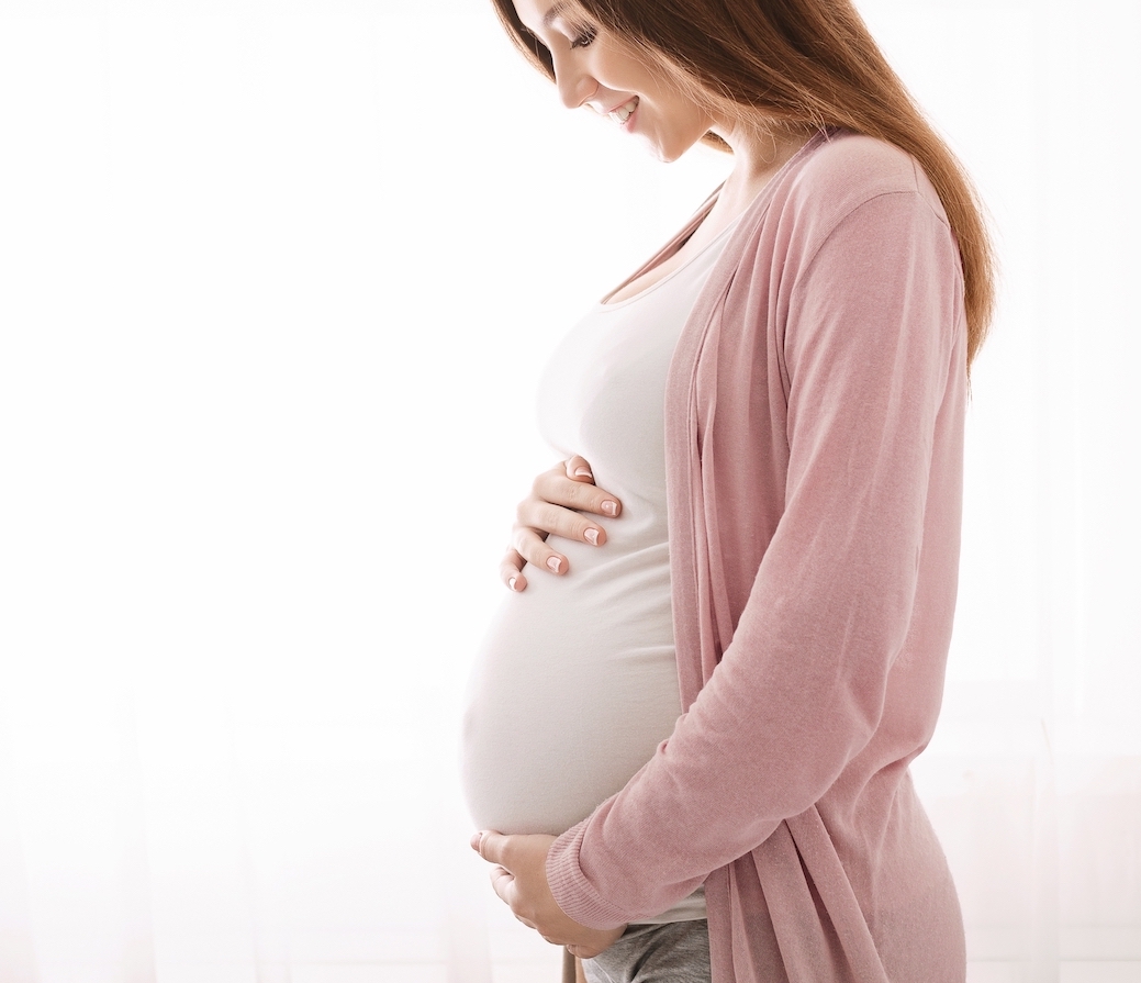 Beautiful,Pregnant,Woman,Hugging,Her,Tummy,,Enjoying,Her,Pregnancy,,Free