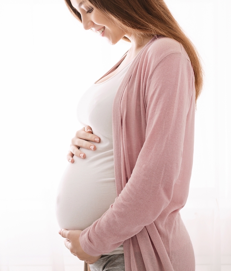 Beautiful,Pregnant,Woman,Hugging,Her,Tummy,,Enjoying,Her,Pregnancy,,Free